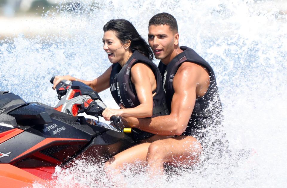  The happy couple zoom through the waves