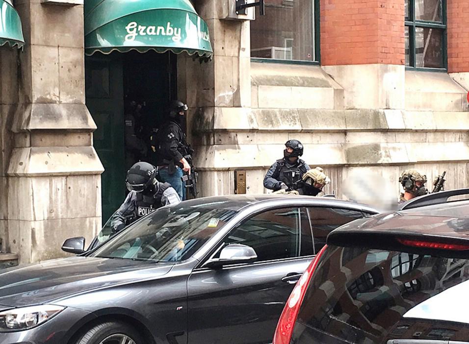 The flat was dramatically raided yesterday afternoon by police and SAS troops 