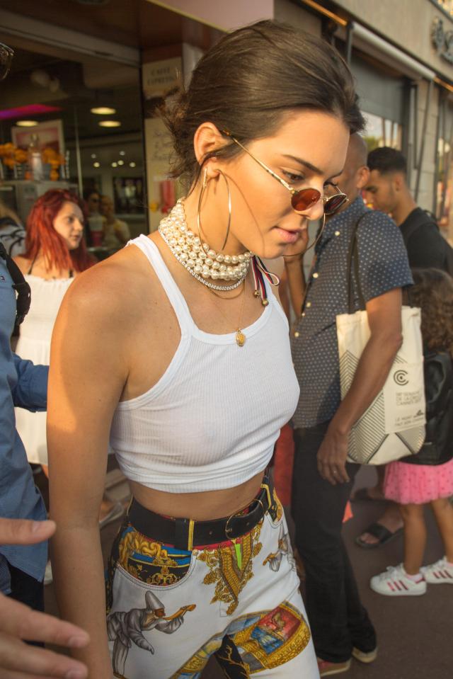  Kendall accessorised with pearls and large hoop earrings