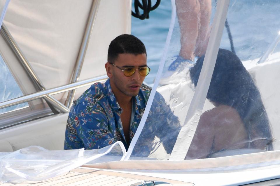  Kourtney and Younes sat comfortably side by side as the boat pulled out into the Mediterranean