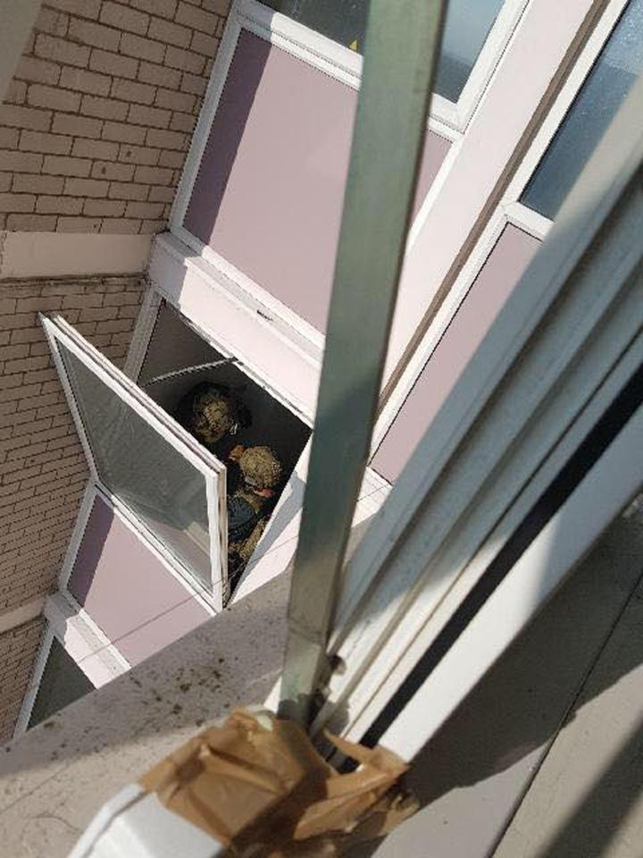 Armed police were pictured at the address in Blackley, Manchester, in a raid connected to Monday's attack