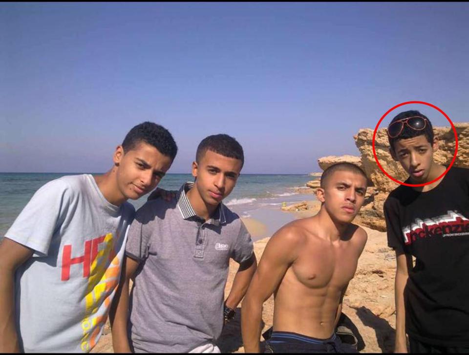  Abedi (right) on beach during one of his many trips to his family home of Libya