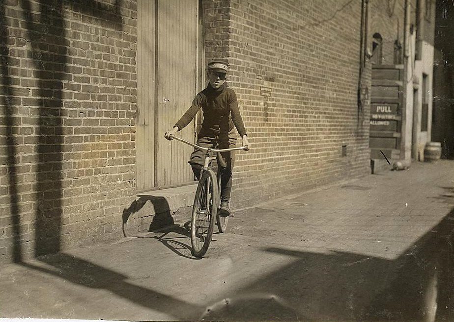  A young boy earning his keep as a messenger in America - before the laws prohibited child labour