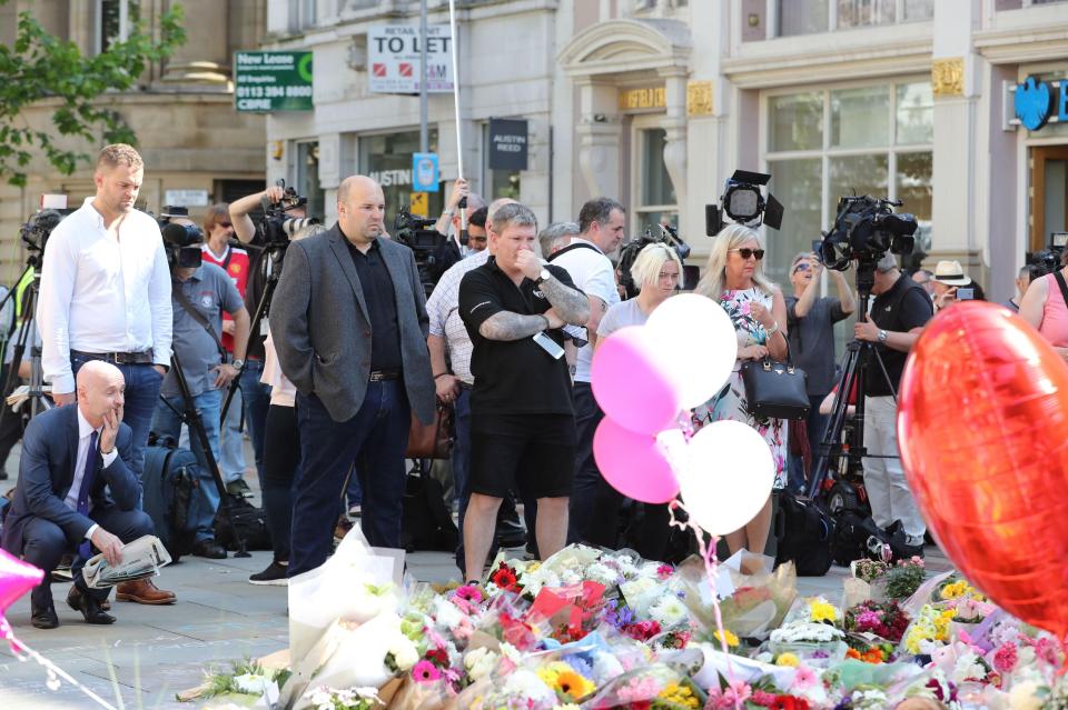  Hatton pauses to reflect after laying a floral tribute to those affected by Monday's terror