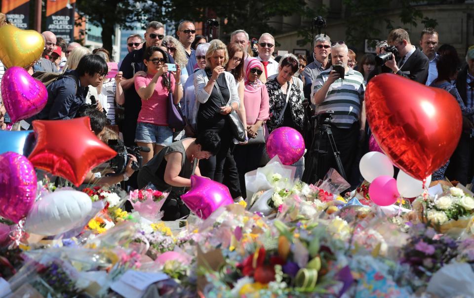  Hundreds of people joined in the minute's silence in St. Anne's Square this morning