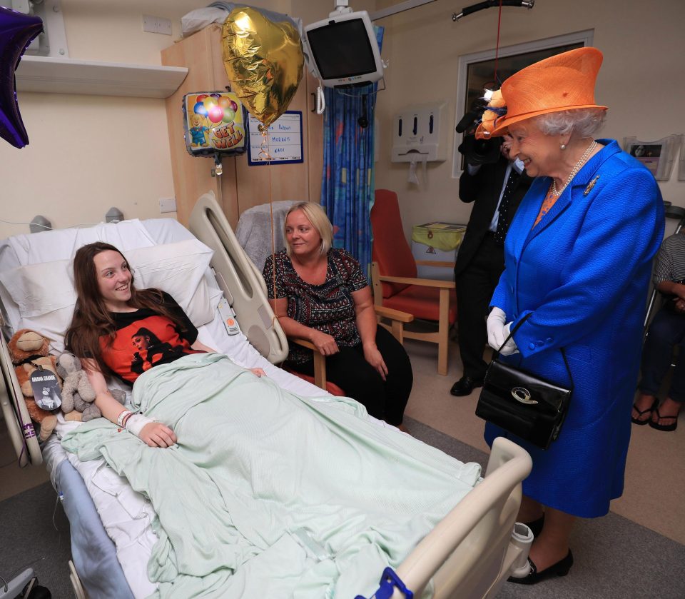  Millie beams while talking to her Majesty from her hospital bed today