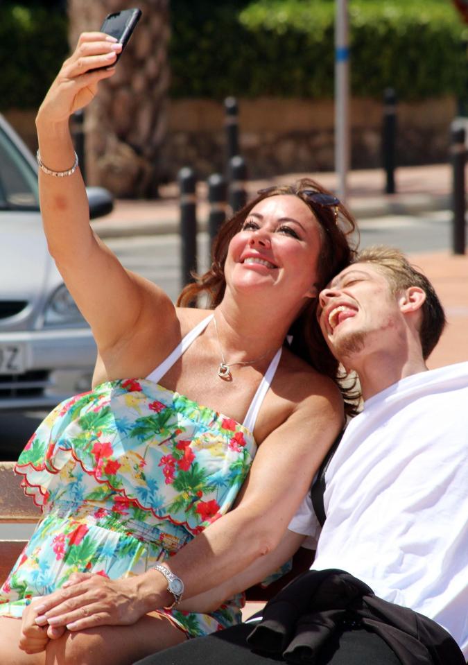  Lisa took a selfie with her toyboy who poked out his tongue for the camera