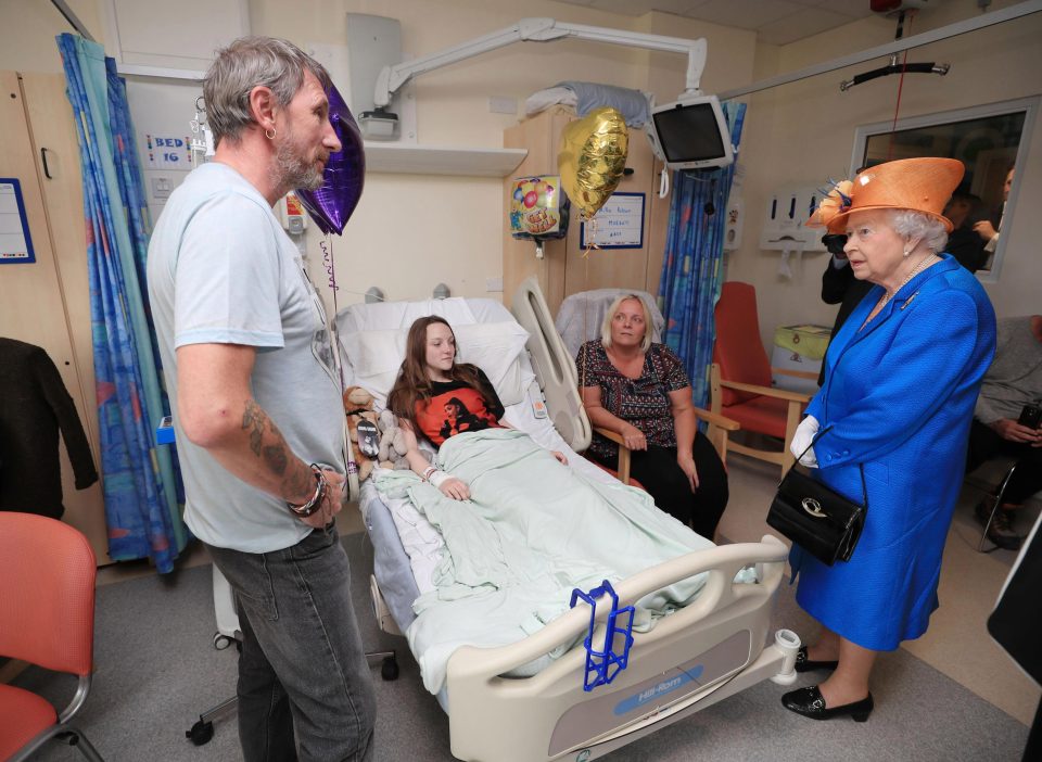  The Queen heard schoolgirl Millie Robson's story of survival as she visited her hospital bed today