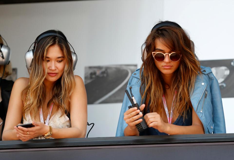  Glamorous spectators keep up with the action at Monaco