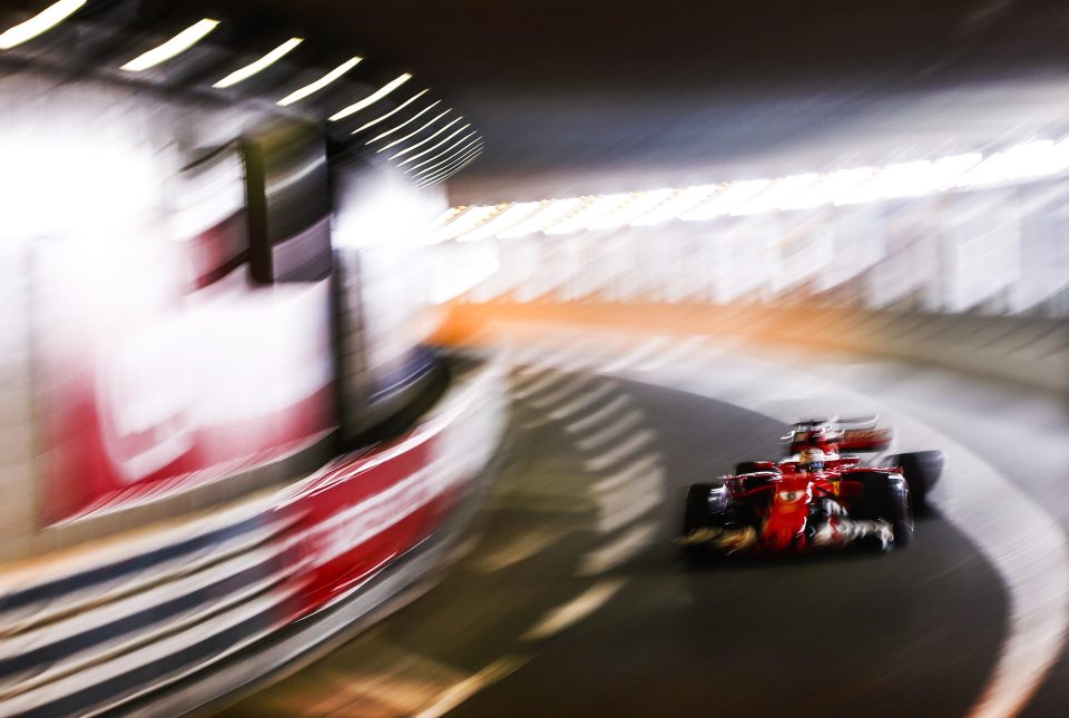  Sebastian Vettel's car takes a corner in a Monaco tunnel