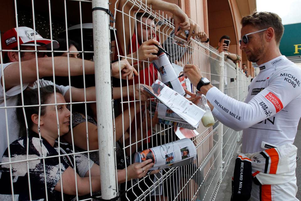  Jenson Button signs autographs after the second practice