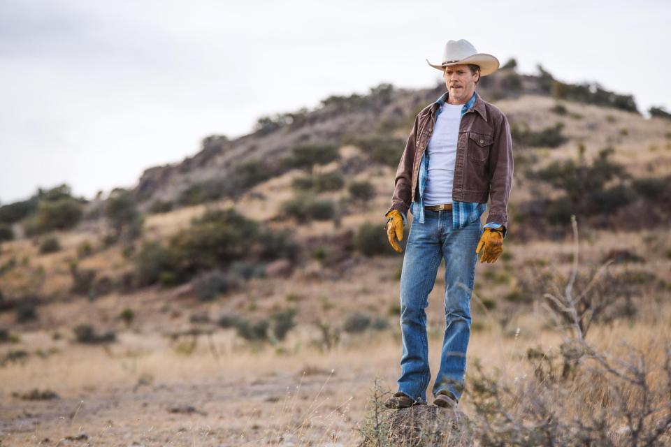  Kevin Bacon's character stands on the Texas ranch