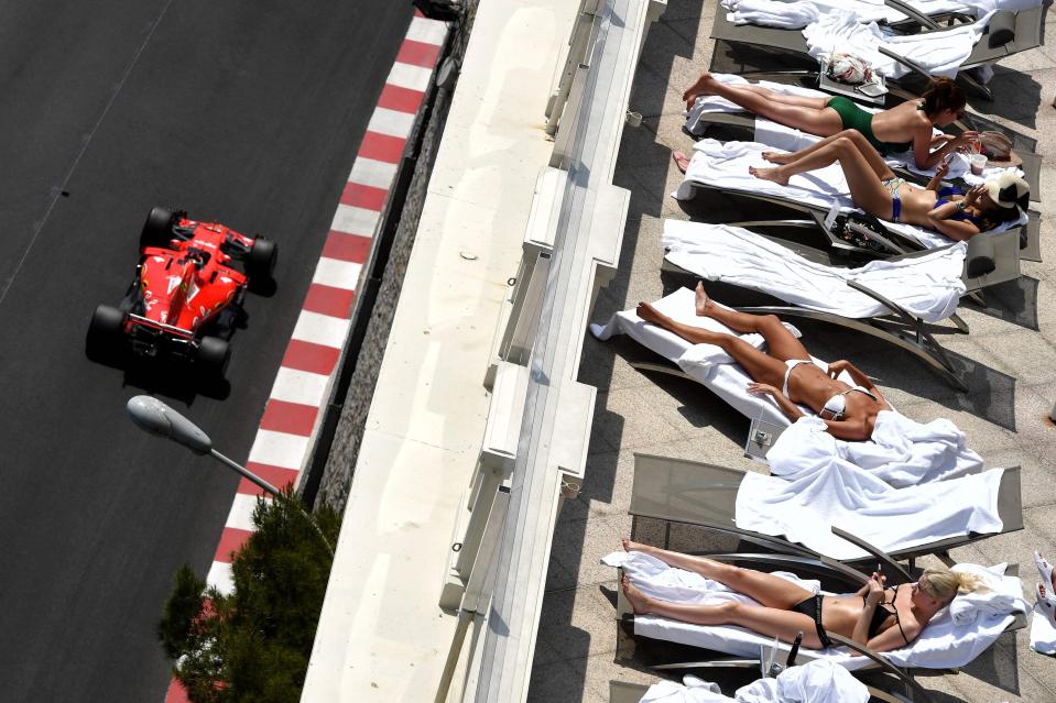  Women out sunbathing in Monte Carlo as the F1 drivers race by just yards away