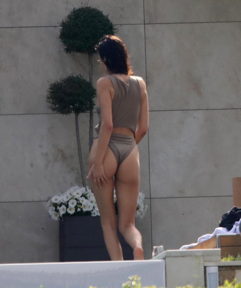  Chloe showed off her perky bum in a sexy grey swimsuit