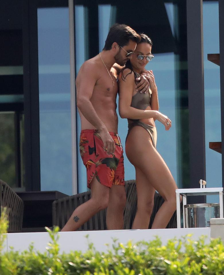  Scott Disick has been pictured cuddling with another bikini clad woman just hours after feeling up Bella Thorne at the same villa