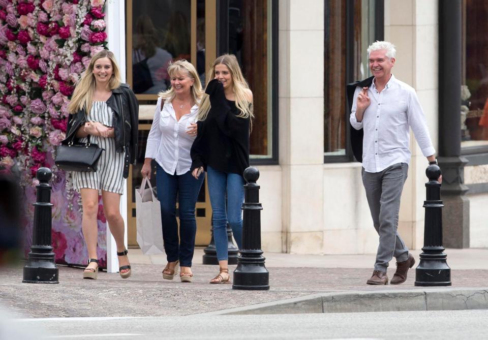  The stylish girls kept their distance from famous father, Phillip