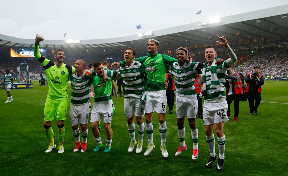  Celtic players celebrated in the rain at Hampden Park