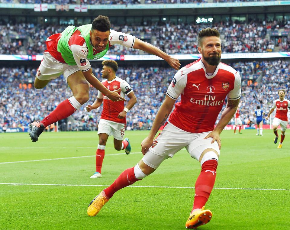 Arsenal Olivier Giroud (R) celebrates after Aaron Ramsey fired the Gunners into a 2-1 lead