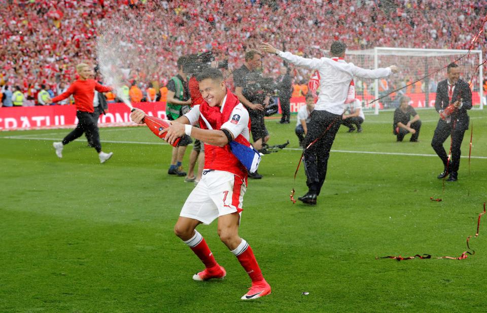 Arsenal star Alexis Sanchez celebrates after winning the FA Cup