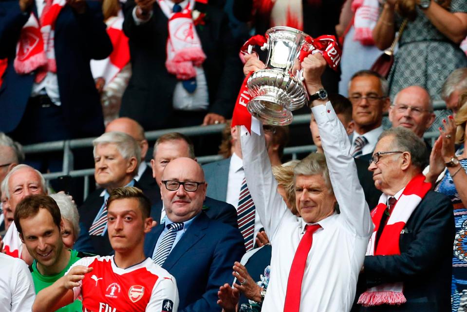 Arsene Wenger lifts the FA Cup - but will he be around next season to defend the trophy?