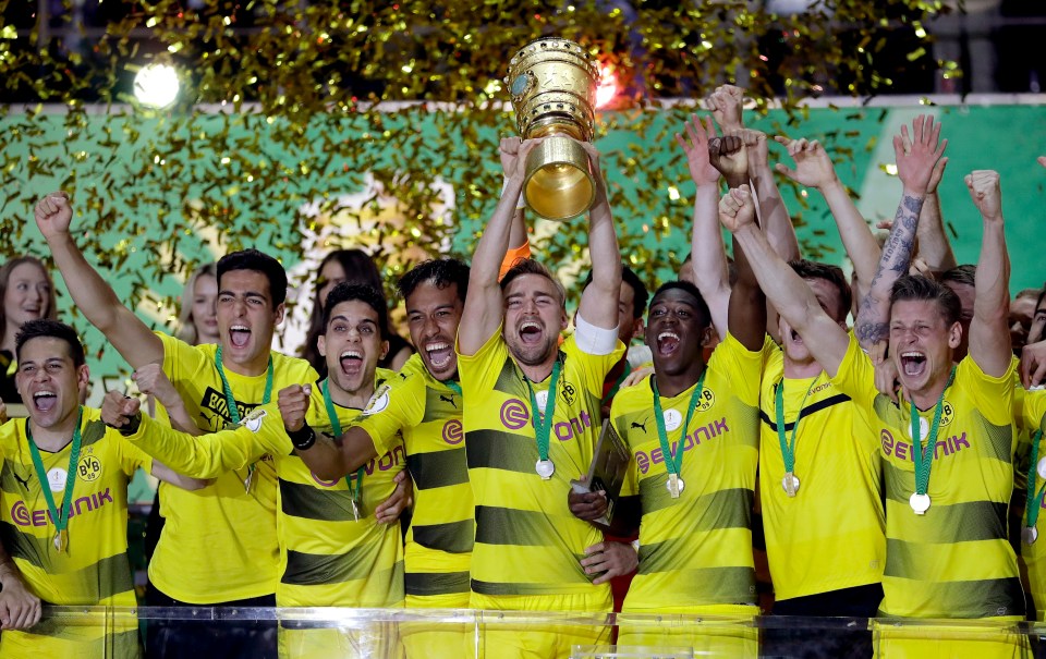 Borussia Dortmund players celebrate winning the cup after three final defeat in a row