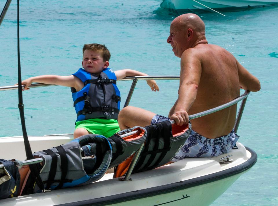  He also joined four-year-old grandson Klay on a boat