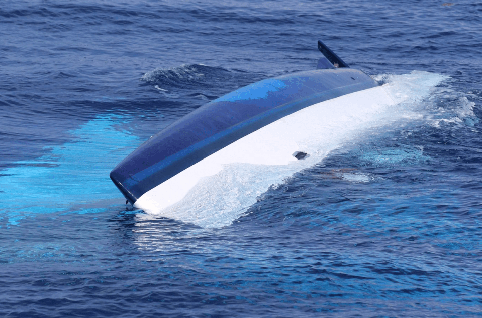  The 37-foot catamaran, Surf into Summer, partially sunk in the Straits of Florida