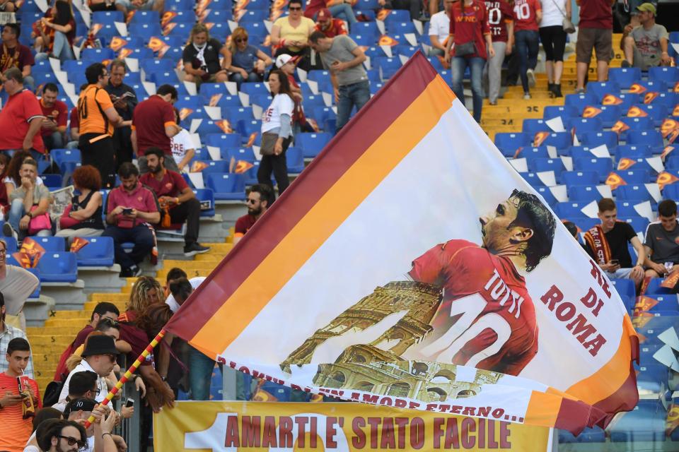 Roma fans wave a giant flag of idol Francesco Totti before the match vs Genoa