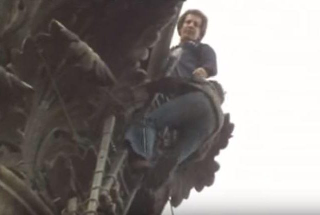  Presenter John seen climbing up Nelsons' Column in one of his impressive stunts