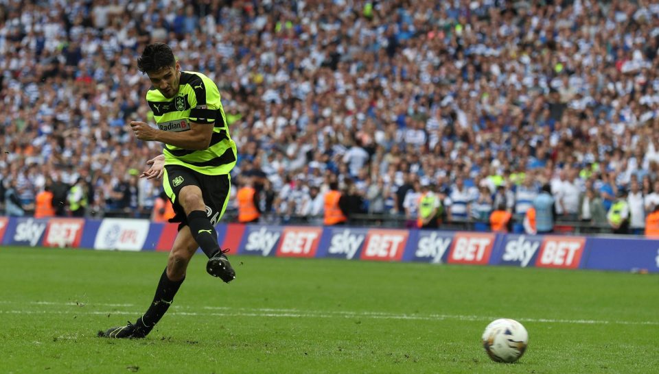  Christopher Schindler scores from the spot to seal promotion for Huddersfield