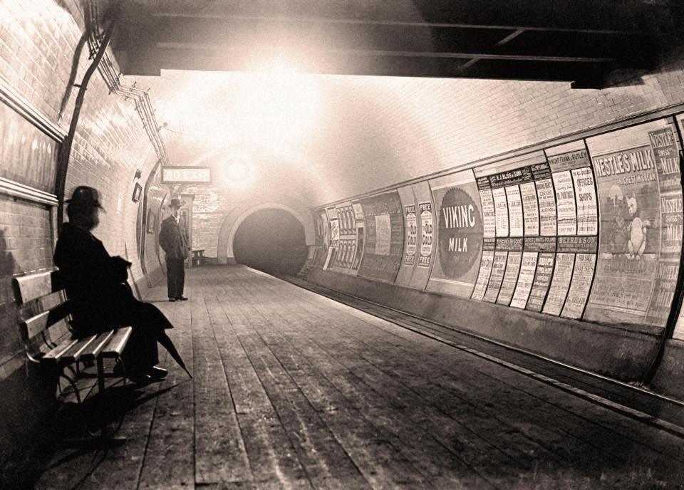  A man sits waiting for a train on the London Underground in 1890, when the platform floors were still made from wooden floorboards