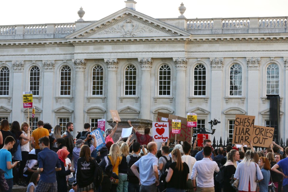 Supporters and protesters gathered outside Senate House in Cambridge