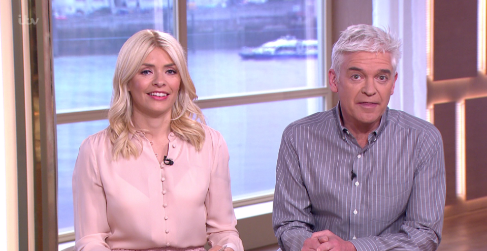  Holly gave viewers a glimpse of her bra in a sheer pink blouse