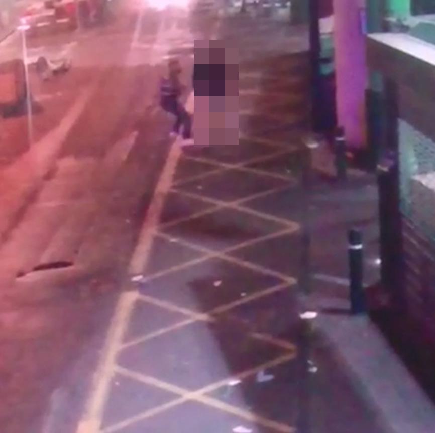 One of the attackers, left, approaches the man in the footage which has emerged this evening on social media