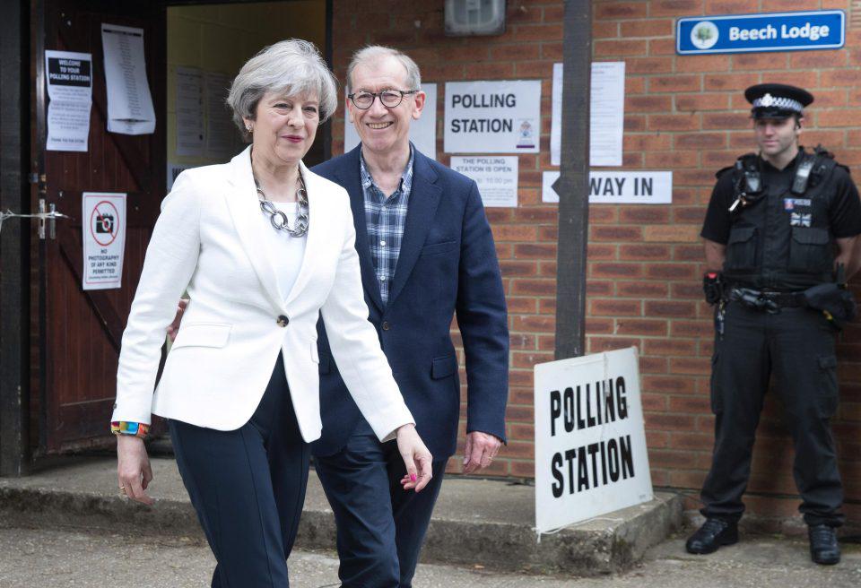  Theresa May was all smiles as she cast her vote with husband Phillip earlier today