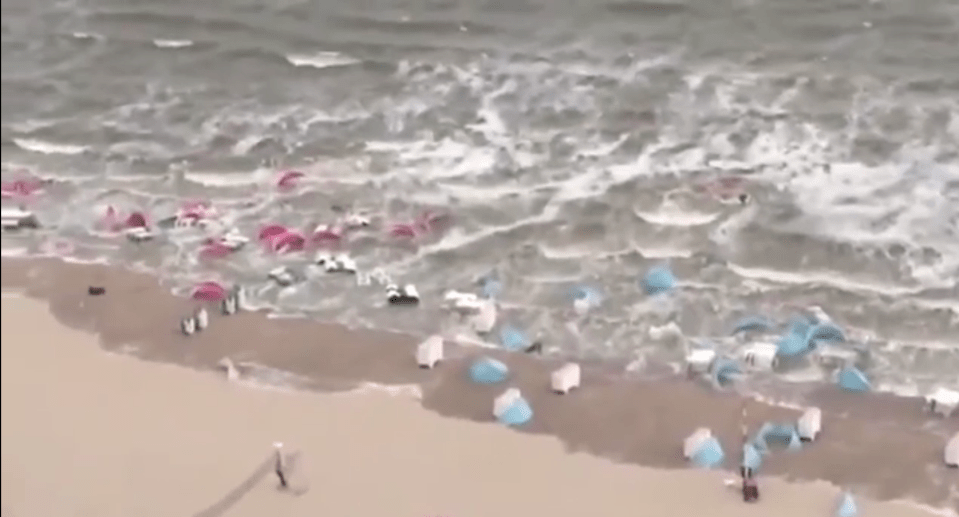 Dramatic clip shows how the seven-foot wave flooded the beach washing away objects on Monday in the Netherlands