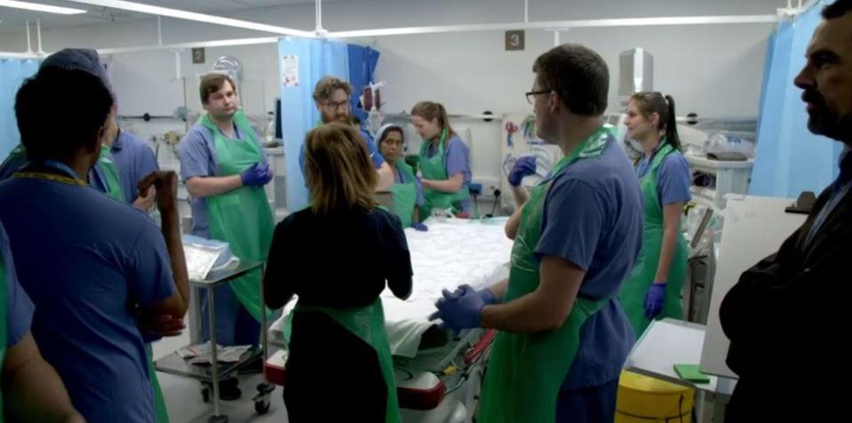  Hospital staff can be seen waiting for the first patient to arrive - but are unaware that it is Masood