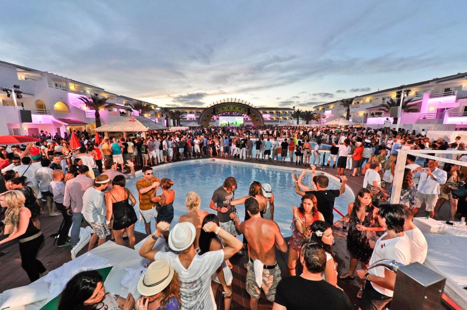 A Saturday evening crowd assemble around the pool area for a party at Ushuaia Hotel in Ibiza 