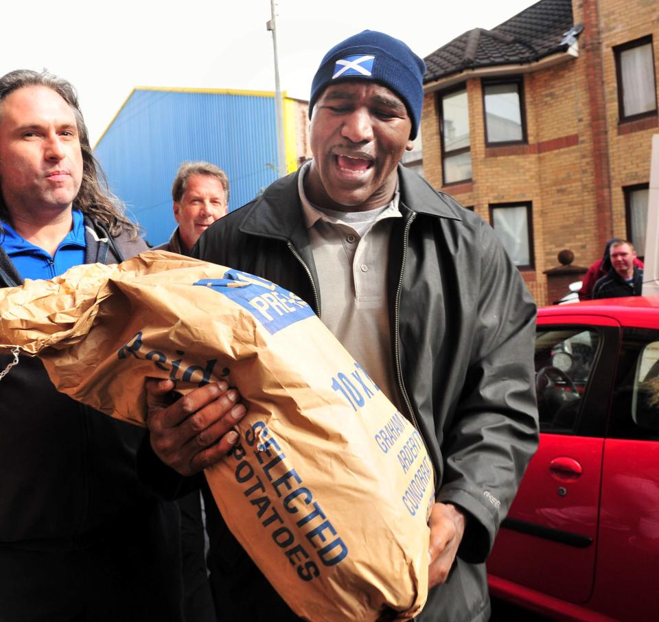  Here is Evander Holyfield doing his bit for the community in Scotland in 2013 - likeable outside the ring and a beast in it