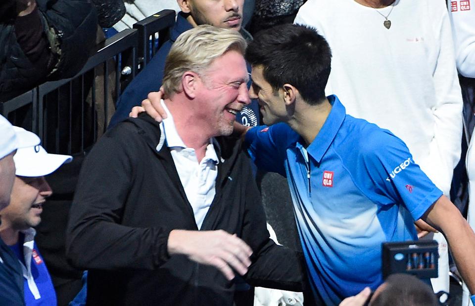  Boris is hugged by Novak Djokovic after he beat Roger Federer in 2015