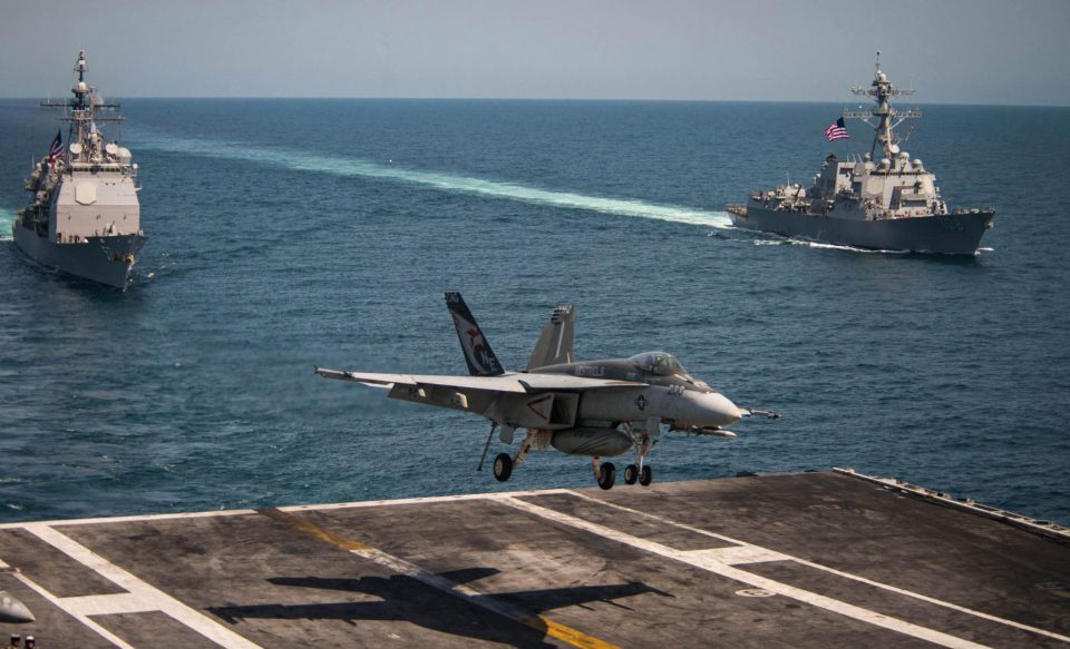  An F/A-18E Super Hornet from the Kestrels of Strike Fighter Squadron 137 lands on the flight deck of the Nimitz-class aircraft carrier USS Carl Vinson