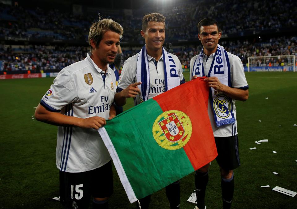  Fabio Coentrao, Cristiano Ronaldo and Pepe celebrate winning La Liga