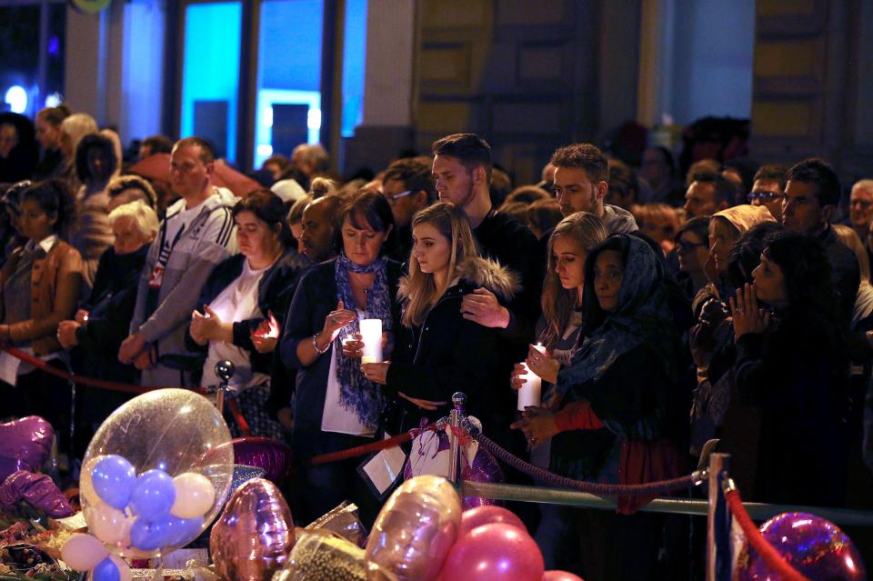  People light candles in St Ann's Square in Manchester