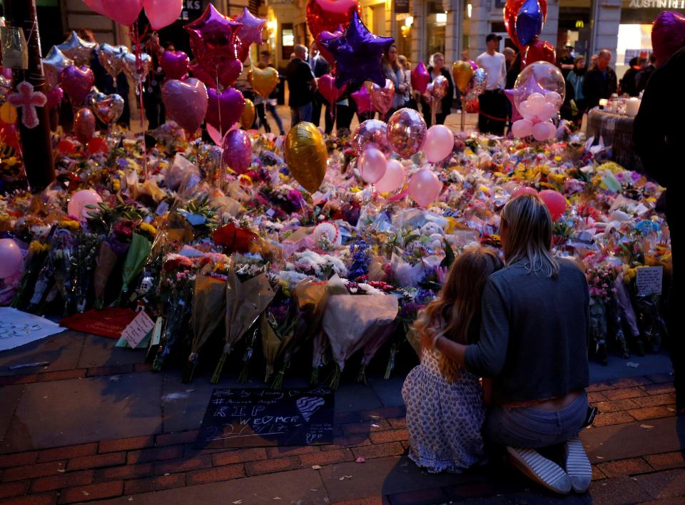  People attend a vigil for the victims of the attack at Manchester Arena