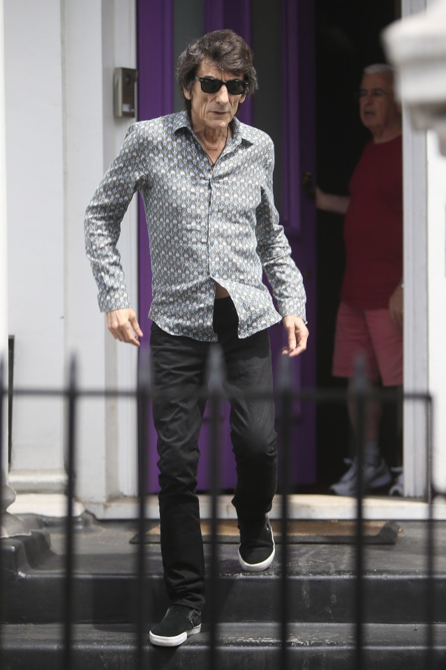 Rolling Stones guitarist Ronnie Wood out and about following recent operation