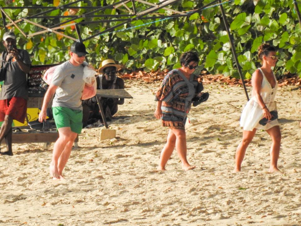 Wayne and Coleen Rooney are pictured on the beach during a holiday in Barbados with her parents 