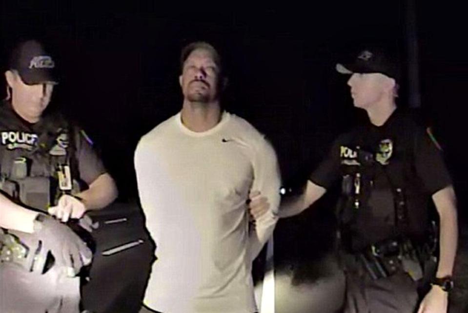  Woods was filmed being walked to a squad car after being arrested on suspicion of DUI