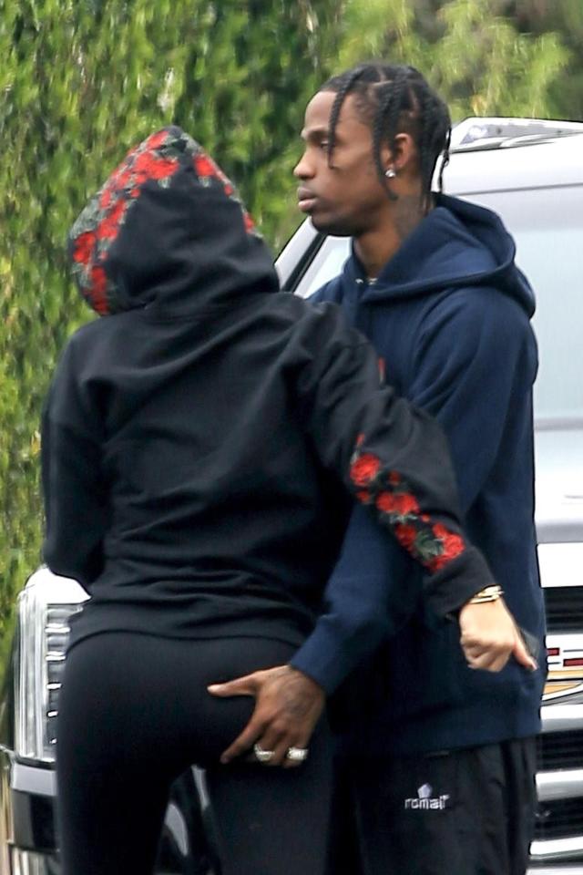  Travis Scott gave his girlfriend Kylie Jenner's bum a firm squeeze as he prepared to fly out of LA yesterday