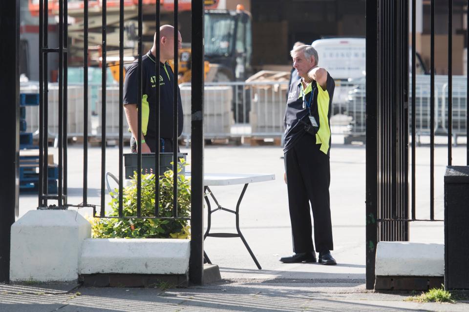 Security at the gates of the cricket ground, which will host the concert