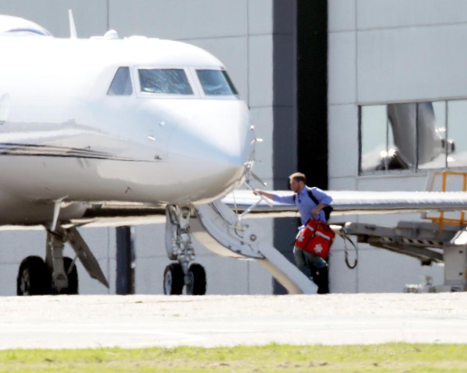  Other members of Taylor's team were also pictured boarding the jet